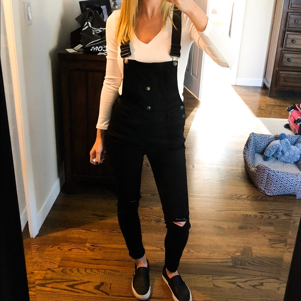 Black distressed skinny overalls